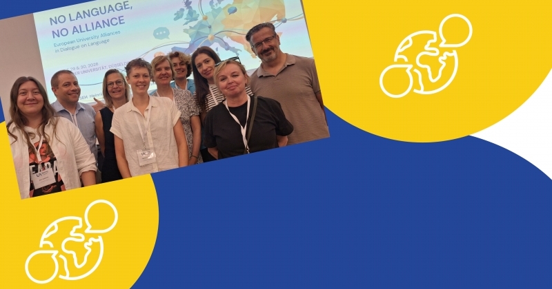 Group of UNIVERSEH 2026 participants in front of the ?No Language, No Alliance? screen.